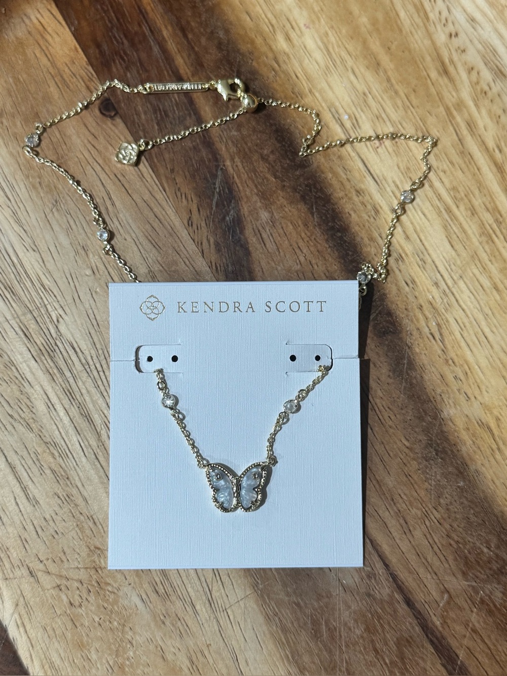 Kendra Scott NWOT Gold Butterfly Necklace with Gray Butterfly shaped Stone.